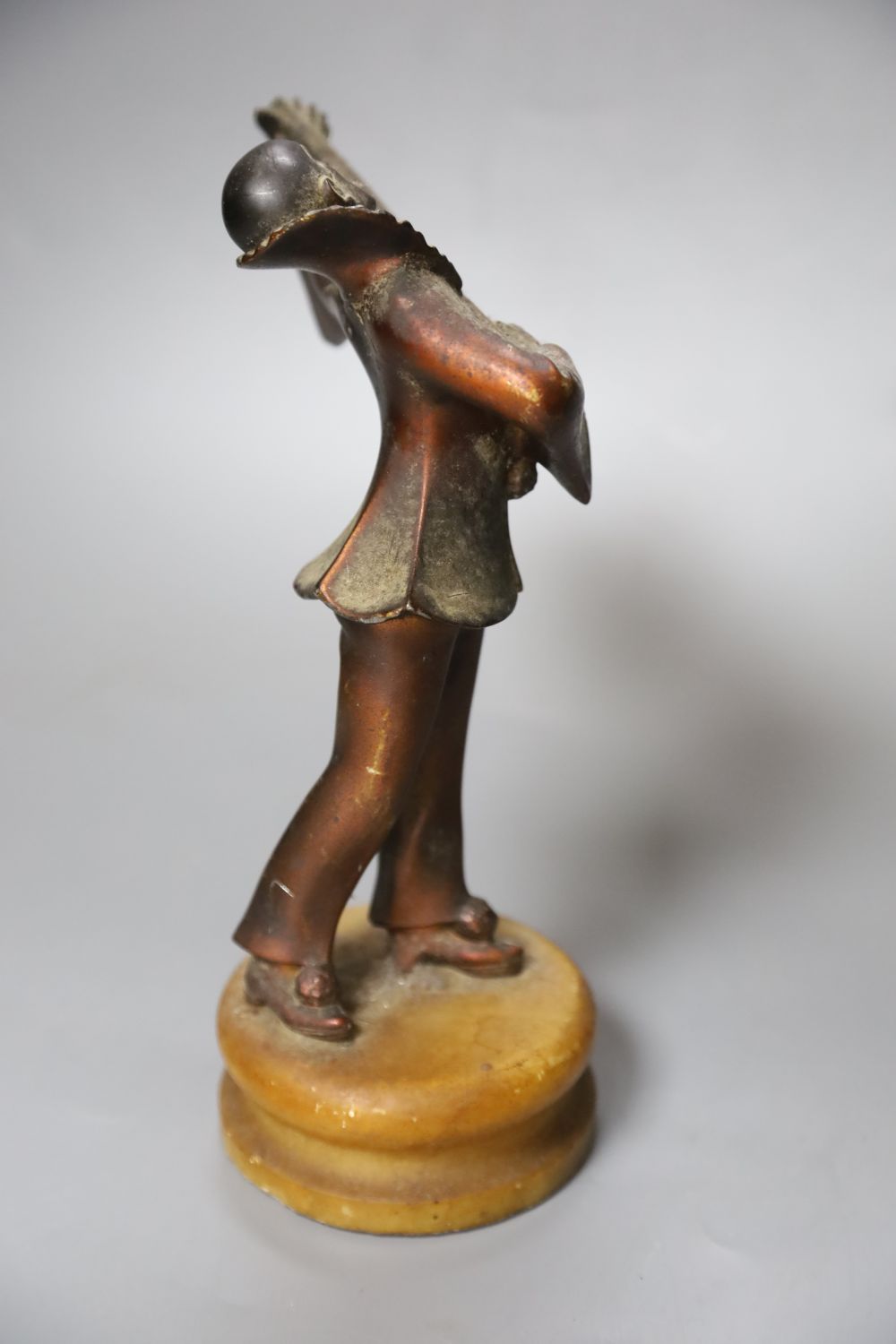 A 1930s Pierrot musician playing the lute, on alabaster plinth, height 23cm